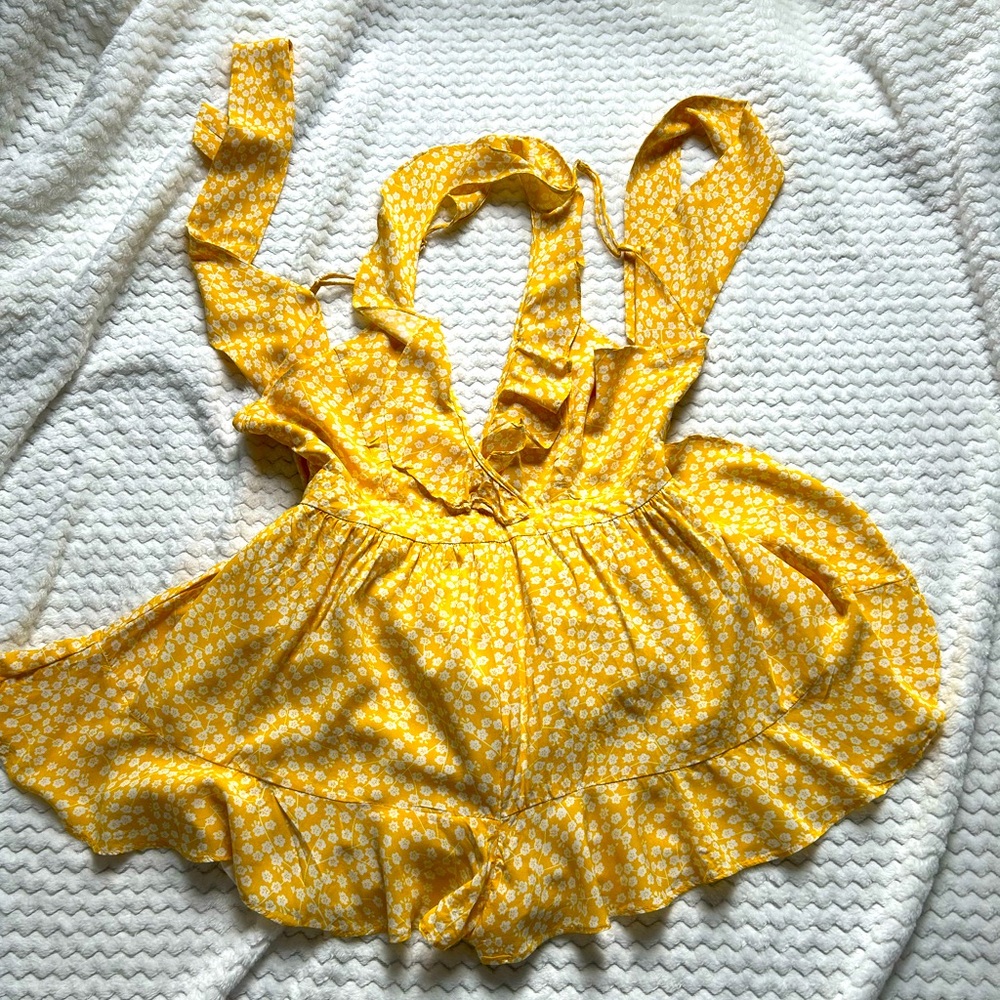 Yellow romper with cross straps and ties